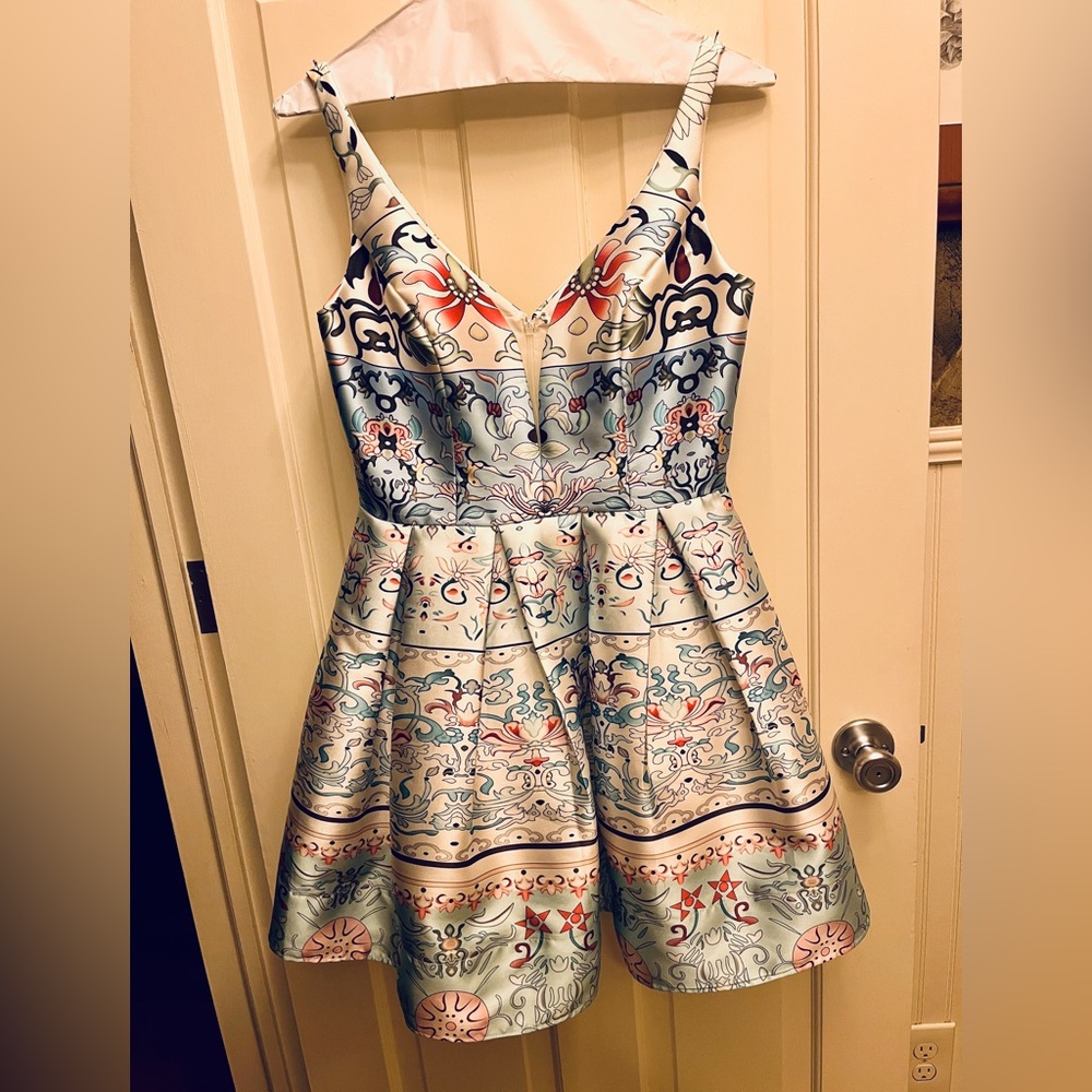 Precious cocktail. Size 10. EUC and has just left the dry cleaner!